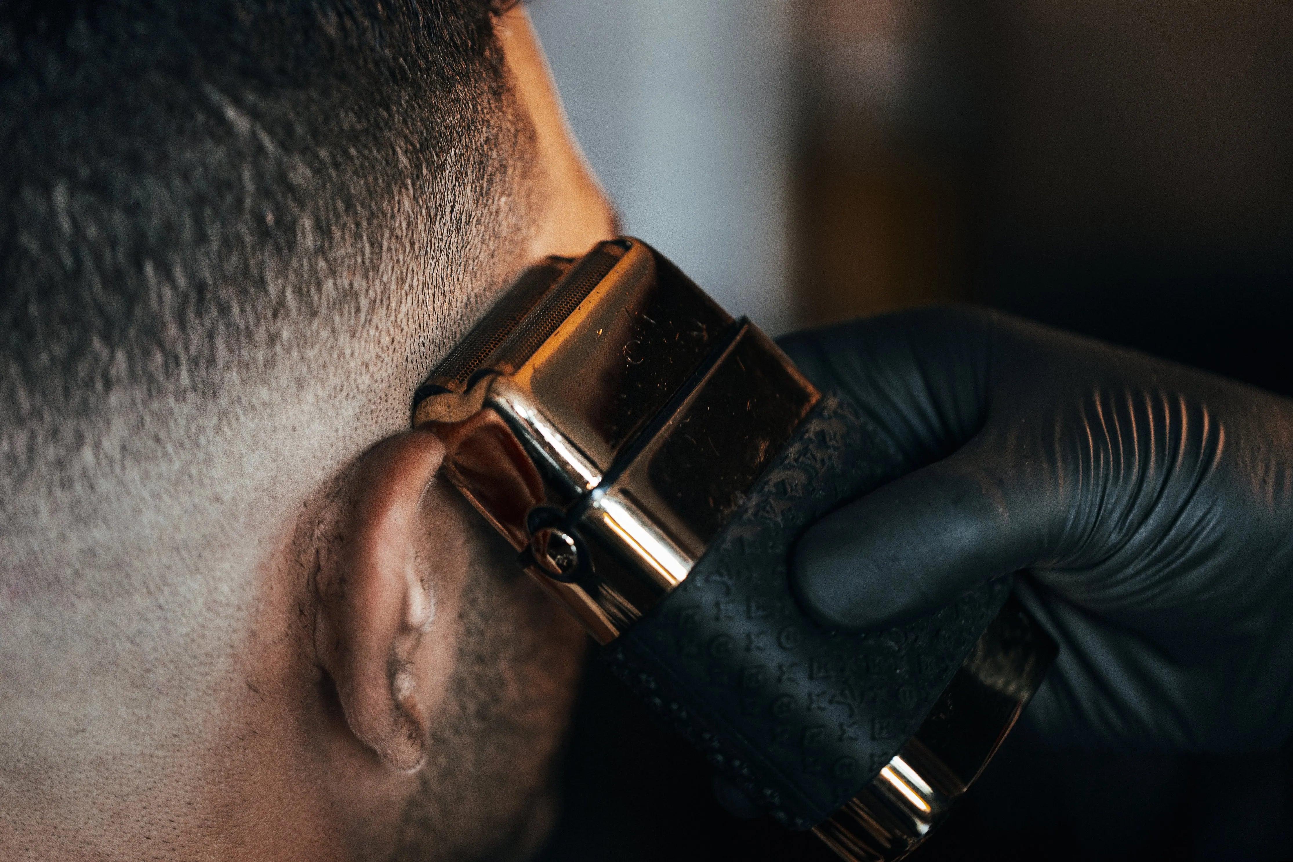 barber-shaves-side-of-persons-head_1 - Nonem Barber Shop™